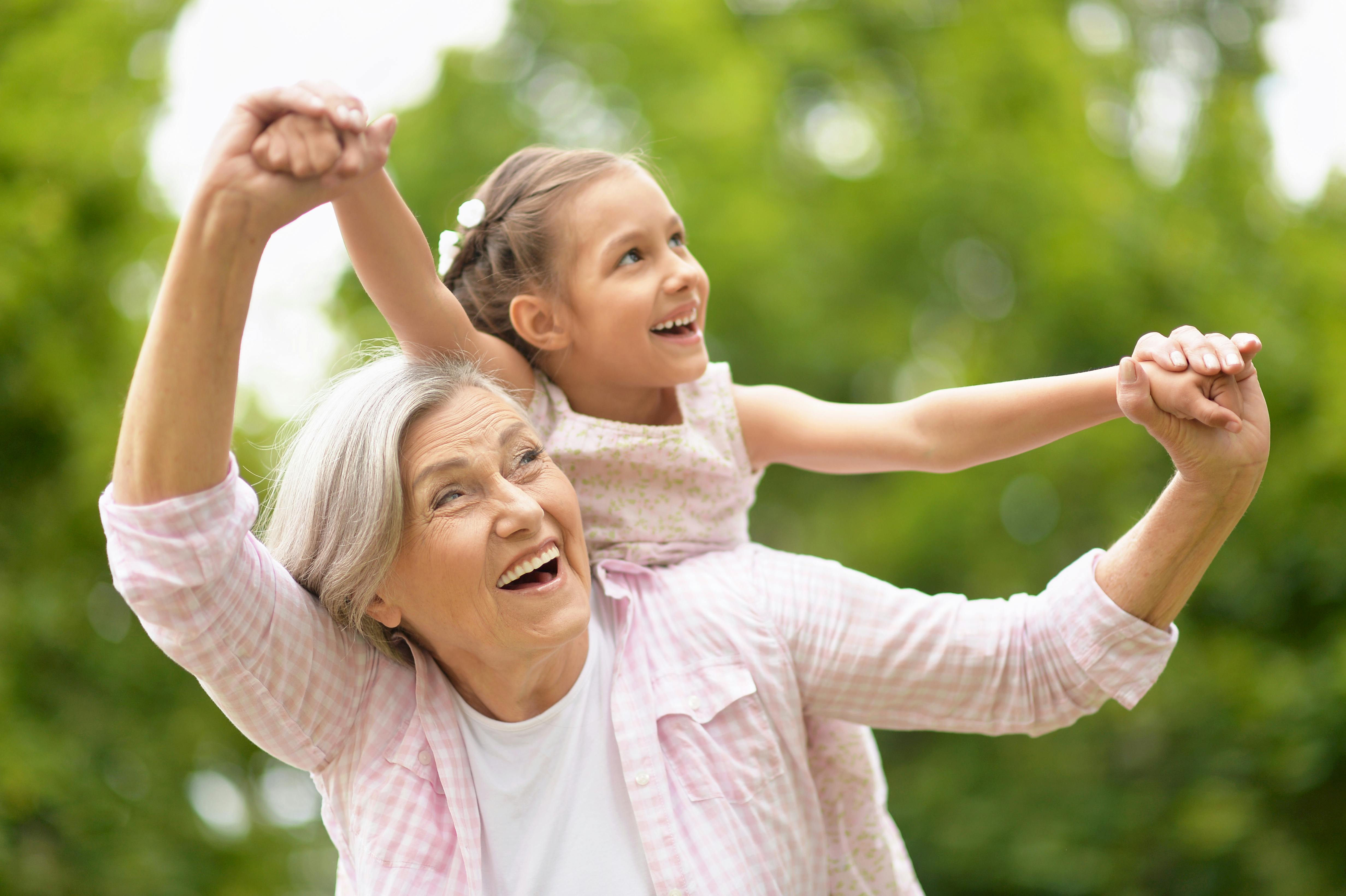 Older woman outside with child Older woman outside with child