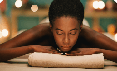 Woman getting a massage to relieve headache pain